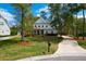 Well-maintained home with lush landscaping, private driveway, and inviting curb appeal at 4029 Cascades Thrust, Summerville, SC 29483