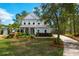 Beautiful two-story home featuring a well-manicured lawn and an inviting, extended driveway at 4029 Cascades Thrust, Summerville, SC 29483