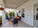 Cozy front porch with comfortable seating and stylish décor, perfect for relaxing outdoors at 4029 Cascades Thrust, Summerville, SC 29483