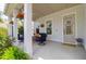 Welcoming front porch with cozy seating, plants, and a charming entrance, great for relaxation at 4029 Cascades Thrust, Summerville, SC 29483