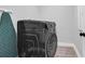 Laundry room with new black front load washing machine and ironing board at 4029 Cascades Thrust, Summerville, SC 29483