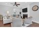 Comfortable living room with a fireplace, large TV, and stylish furniture, perfect for relaxation at 4029 Cascades Thrust, Summerville, SC 29483