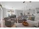 Open-concept living space with kitchen, dining, and living areas featuring stylish furnishings and natural light at 4029 Cascades Thrust, Summerville, SC 29483