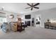 A comfy living room featuring a wall mounted TV, with ample seating with access to another room at 4029 Cascades Thrust, Summerville, SC 29483