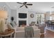 Comfortable living room area, with a fireplace, TV, ceiling fan, with sliding doors to a patio area at 4029 Cascades Thrust, Summerville, SC 29483