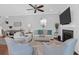 Inviting living room featuring a fireplace, large TV, and comfortable seating, ideal for relaxation and entertainment at 4029 Cascades Thrust, Summerville, SC 29483