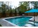 Backyard pool with fountain feature and travertine deck offers a tranquil retreat at 4029 Cascades Thrust, Summerville, SC 29483