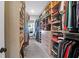 Spacious walk-in closet with custom shelving, hanging rods, and ample storage for clothes and accessories at 4029 Cascades Thrust, Summerville, SC 29483