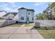 Well-maintained backyard featuring a fenced-in yard and manicured lawn, complementing the blue siding at 412 Hydrangea St, Summerville, SC 29483