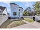Charming home featuring a fenced-in yard and manicured lawn with blue siding and modern architectural design at 412 Hydrangea St, Summerville, SC 29483
