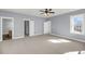 Large bedroom with natural light, ceiling fan, and access to a walk-in closet at 412 Hydrangea St, Summerville, SC 29483