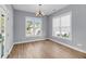Bright dining room with hardwood floors, natural light and a chandelier fixture at 412 Hydrangea St, Summerville, SC 29483