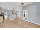 Light-filled dining area with hardwood floors and modern chandelier fixture at 412 Hydrangea St, Summerville, SC 29483