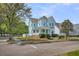 Attractive two-story house featuring a welcoming front porch and a well-maintained lawn at 412 Hydrangea St, Summerville, SC 29483