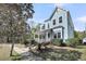 Charming two-story home featuring a welcoming front porch, blue siding, and lush landscaping at 412 Hydrangea St, Summerville, SC 29483