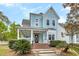 Charming two-story home with a inviting front porch and well-manicured landscaping at 412 Hydrangea St, Summerville, SC 29483