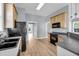 Functional kitchen with ample cabinet space, black appliances, and a spacious layout at 412 Hydrangea St, Summerville, SC 29483