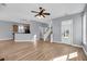 Open living area leading to kitchen with hardwood floors, perfect for entertaining at 412 Hydrangea St, Summerville, SC 29483