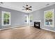 Bright living room featuring hardwood floors, white trim, and a cozy fireplace at 412 Hydrangea St, Summerville, SC 29483