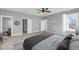 Cozy bedroom featuring soft carpet, ceiling fan, and plenty of closet space at 412 Hydrangea St, Summerville, SC 29483