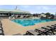 A large, inviting pool with plenty of lounge chairs is surrounded by the clubhouse at this community at 412 Hydrangea St, Summerville, SC 29483