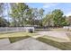 Front yard with a well-maintained lawn and paved walkway, and a white picket fence outlining the property at 412 Hydrangea St, Summerville, SC 29483
