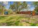 Expansive green back yard with a shed, play set, and trees at 4418 Hardwood St, Ladson, SC 29456
