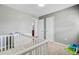 Bedroom with a window, a crib, and a dresser at 4418 Hardwood St, Ladson, SC 29456