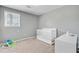 Bedroom with a window, a crib, and a dresser at 4418 Hardwood St, Ladson, SC 29456
