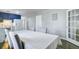 Dining room showing table with four chairs, kitchen, and French doors at 4418 Hardwood St, Ladson, SC 29456