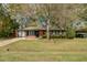 Charming single-story brick home with a well-maintained front yard and mature tree at 4418 Hardwood St, Ladson, SC 29456