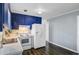 This kitchen features two-basin sink, white appliances and blue painted cabinets at 4418 Hardwood St, Ladson, SC 29456