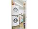 Convenient laundry area with stackable washer and dryer, storage, and water heater at 4418 Hardwood St, Ladson, SC 29456