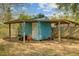 Storage shed with a covered area and toys stored inside the beams at 4418 Hardwood St, Ladson, SC 29456