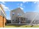 Large backyard featuring a brick patio, swing set, and expansive green space at 449 Whispering Breeze Ln, Summerville, SC 29486