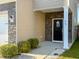 Inviting front porch with stone accents and a black door with a pineapple wreath and the address number 449 at 449 Whispering Breeze Ln, Summerville, SC 29486