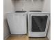 Modern laundry room features a side-by-side washer and dryer for convenience at 449 Whispering Breeze Ln, Summerville, SC 29486