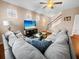 Comfortable living room featuring a sectional sofa, a modern entertainment center with a TV, and a cozy atmosphere at 449 Whispering Breeze Ln, Summerville, SC 29486