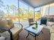 Charming screened-in porch with a ceiling fan and views of the brick patio at 449 Whispering Breeze Ln, Summerville, SC 29486