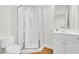 Bathroom featuring glass door shower, white vanity and wood grain flooring at 4512 Great Oak Dr, North Charleston, SC 29418