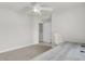Bright bedroom with a ceiling fan, neutral carpet, white walls, and a nearby doorway at 4512 Great Oak Dr, North Charleston, SC 29418