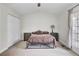 Bedroom with neutral walls, carpet, a ceiling fan, a queen bed, and two bedside tables at 4512 Great Oak Dr, North Charleston, SC 29418