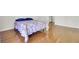 This bedroom features hardwood floors, blue bedding, and neutral walls for a cozy feel at 4512 Great Oak Dr, North Charleston, SC 29418