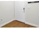 Front door with electronic lock and wooden floors, offers secure and stylish entry at 4512 Great Oak Dr, North Charleston, SC 29418