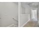 Upstairs hallway featuring neutral walls, carpet, and doors leading to various rooms for a seamless living experience at 4512 Great Oak Dr, North Charleston, SC 29418