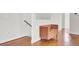 Hallway with hardwood floors and a brown bench perfect for a stylish entryway at 4512 Great Oak Dr, North Charleston, SC 29418