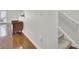 Living room with hardwood floors, neutral walls, and a comfortable couch near a window for natural light at 4512 Great Oak Dr, North Charleston, SC 29418