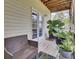 Outdoor patio with comfortable seating, potted plants, and a view of the backyard at 4512 Great Oak Dr, North Charleston, SC 29418