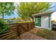 Cozy backyard with a storage shed, a wooden privacy fence, and lush greenery at 5132 E Liberty Park Cir, North Charleston, SC 29405