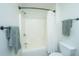 Bright bathroom features a shower-tub combo with modern fixtures and neutral-toned towels at 5132 E Liberty Park Cir, North Charleston, SC 29405